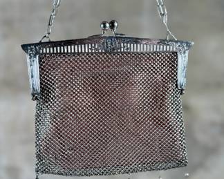 This lot features a pair of antique German silver mesh flapper purses from the late 19th century in good condition. One is marked, "German Silver" as shown in photos.