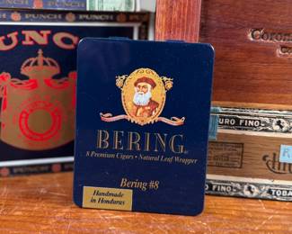 This lot features a curated collection of vintage cigar boxes in various conditions.