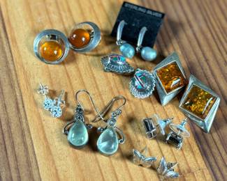 This lot features a curated collection of eight (8) pairs of sterling silver earrings with a total approx. weight of 32.21 grams.