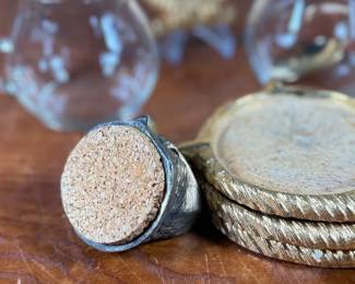 This lot features a vintage owl themed set with two jars manufactured by Ted Arnold Ltd., and a set of four (4) "owl" coasters.