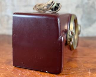 This lot features a vintage Crosley bakelite radio, specifically a "dashboard" model circa 1950s. Comes untested.