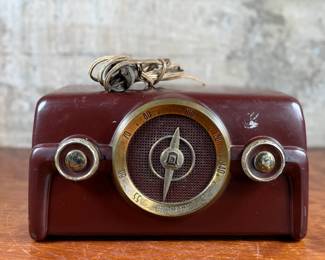 This lot features a vintage Crosley bakelite radio, specifically a "dashboard" model circa 1950s. Comes untested.