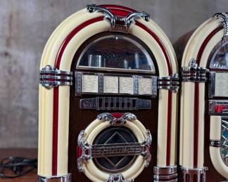 This lot features a pair of jukebox-style radios, likely considered vintage now! They measure, 15” H and come untested.