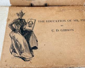 This lot features a pair of antique illustrated books featuring drawings by Charles Dana Gibson. A Widow and Her Friends is a hardcover book published around 1901, featuring the iconic Gibson Girl illustrations. The Education of Mr. Pipp is another collection of Gibson’s works, often bound similarly in large folio formats. 