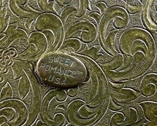 This lot features a pair of antique compacts manufactured by Dorset Fifth Avenue & Sweet Romance.