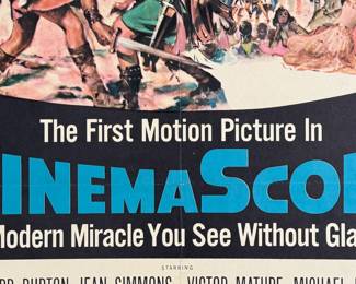 This lot features an original movie poster from The Robe circa 1953. This lithograph movie poster is limited edition, numbered 53/440. Measures in frame, 41” H x 27” W.