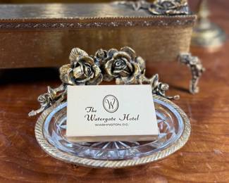 This lot features a curated collection of vintage Hollywood Regency-style bathroom accessories including a soap tray, a tissue holder, waste basket, and more.