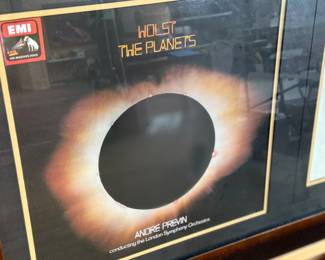 This lot features a professionally framed collectible display featuring the 1974 vinyl album of Holst: The Planets, conducted by André Previn with the London Symphony Orchestra. This piece also includes a signed letter by composer, Gustav Holst. Measures in frame, 19” H x 31” W.