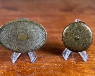 This lot features a pair of antique compacts manufactured by Dorset Fifth Avenue & Sweet Romance.