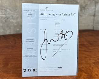 This lot features a signed program of American conductor and violinist, Joshua Bell.