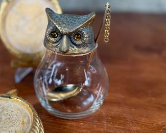 This lot features a vintage owl themed set with two jars manufactured by Ted Arnold Ltd., and a set of four (4) "owl" coasters.