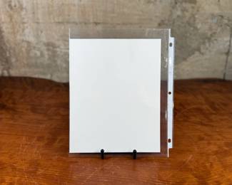 This lot features a signed photograph of actor Eric Close.