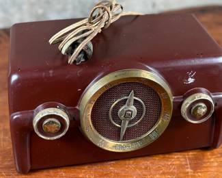 This lot features a vintage Crosley bakelite radio, specifically a "dashboard" model circa 1950s. Comes untested.