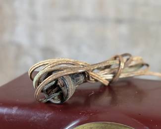 This lot features a vintage Crosley bakelite radio, specifically a "dashboard" model circa 1950s. Comes untested.