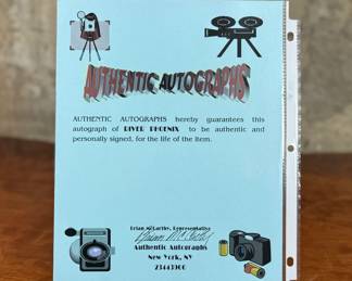This lot features a signed photograph of actor River Phoenix and comes with a certificate of authenticity. 