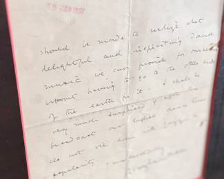 This lot features a professionally framed two-sided letter signed by composer, Ralph Vaughan Williams along with a LP by composer Sir John Barbirolli. Measures in frame, 31” H x 21.5” W.