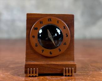 This lot features an Art Deco style 8-day clock manufactured by Seth Thomas in good working condition.