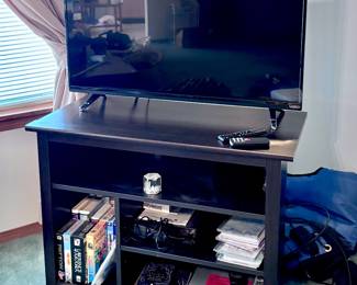 Flatscreen TV, Console Table and Movies