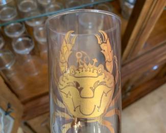 Two sets of astrological sign drink ware, glasses