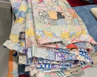 8 partially completed quilts