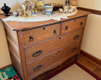 main floor bedroom with bed in it. down hallway to the right.