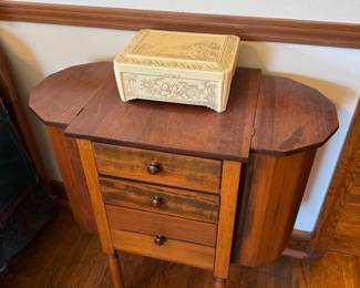 main floor bedroom with bed in it. down hallway to the right.