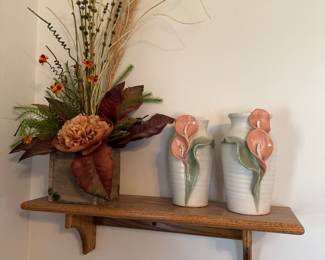 main floor bedroom with bed in it. down hallway to the right.