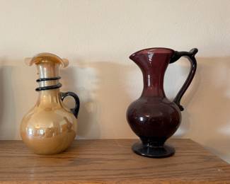 main floor bedroom with bed in it. down hallway to the right.
