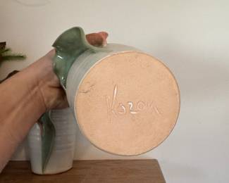 main floor bedroom with bed in it. down hallway to the right.