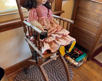 main floor bedroom with bed in it. down hallway to the right.