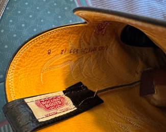 main floor bedroom with bed in it. down hallway to the right.