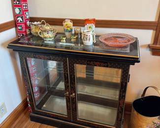 main floor bedroom with bed in it. down hallway to the right.