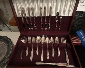 his vintage flatware set is the Nobility Plate silverware set in the "Royal Rose" pattern, produced by Oneida Ltd. starting around 1939.