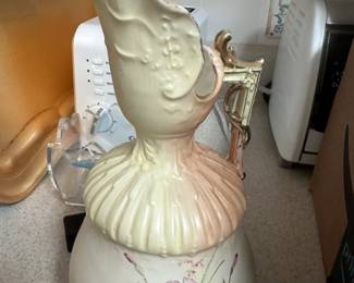 Art Nouveau ewer or pitcher-shaped vase, likely produced by the Robert Hanke porcelain factory in Austria around the turn of the 20th century. 
