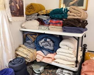 Assortment of comforters, blankets and throws