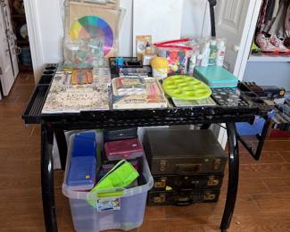 Art table, art supplies, vintage suitcases