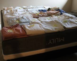 Queen foam mattress set (upside down) displaying linens, upstairs