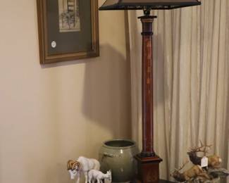 Corner in LR with drawing on wall, animal porcelain pieces under lamp