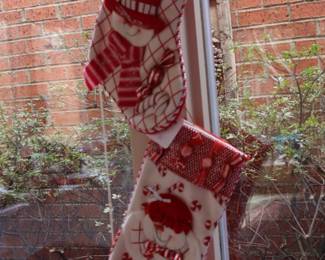 2 of many special Christmas stockings, sunroom