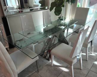 Different angle chrome and glass dining table