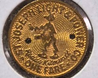 Vintage gold "St. Joseph Light & Power Co. One Fare" roll of tokens