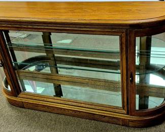 Modern mirrored back lighted curio cabinet with glass center shelf