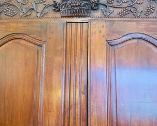 Curved carved bonnet on Antique French armoire 