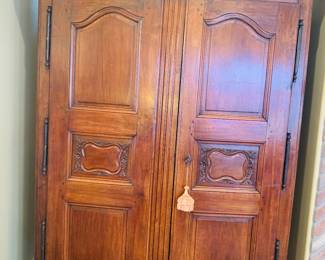 Antique French walnut armoire with curved bonnet 