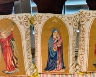 Three needle point religious pillows