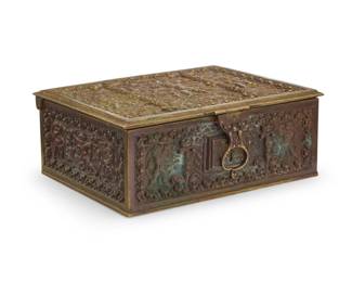 2118 An Erhard & Sohne Renaissance Revival brass box Early 20th century Impressed to underside: [lion cipher over 'E'] / GERMANY Decorated to the top and sides with putti and foliate motifs, the locking lid opening to reveal a wood-lined interior 3.125" H x 7.75" W x 6.375" D Estimate: $300 - $500