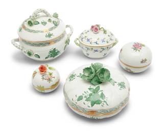 2027 A group of five Herend porcelain covered boxes Late 20th century Each with blue printed factory mark and variously numbered Comprising a 'Green Chinese Bouquet' candy box and small tureen, a 'Blue Garland' oval lidded bon bon, a 'Queen Victoria' lidded bon bon, and an 'Eton' lidded trinket box 5 pieces Tallest: 5.875" H x 7.5" W x 5.75" D; Smallest: 3" H x 3" Dia. Estimate: $400 - $600