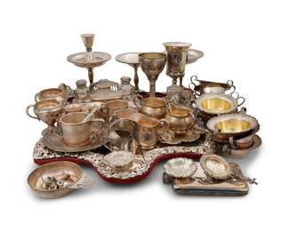 2001 A group of .800 standard and sterling silver articles 19th/20th century Each marked for sterling or .800 silver Comprising ten Shreve & Co. two-handled ramekins, cream and sugars, an inkstand, weighted bowls and vases, an Israeli chalice, a mirror front, and other items Together with an Abercrombie & Fitch silver-plated flask, an unmarked chalice, an unmarked tray, an unmarked jigger mounted with turquoise, and an unmarked clock case Mirror: 23" H x 20.5" W x 2.5" D Total weighable sterling: 90.7 gross oz. troy approximately Estimate: $2,000 - $4,000