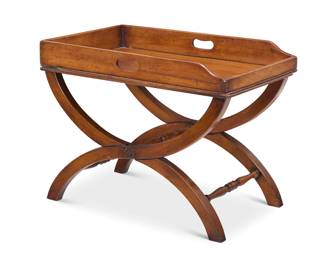 2080 A George III mahogany butler's tray on later stand Early 19th century The handled tray raised on a curved X-form base with turned stretchers and later felt-lined top 2 pieces Tray: 3.625" H x 28" W x 17.5" D Stand: 17.75" H x 27.25" W x 16.5" D Estimate: $300 - $500