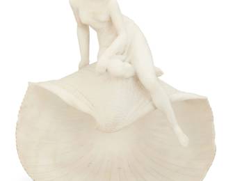 2063 Pietro Emilio Fiaschi (1858-1941) An Italian carved marble nude maiden on a shell, early 20th century Incised to underside: P. C. E. Fiaschi / Firenze / made in Italy 16.25" H x 14.25" W x 8.75" D Estimate: $200 - $300